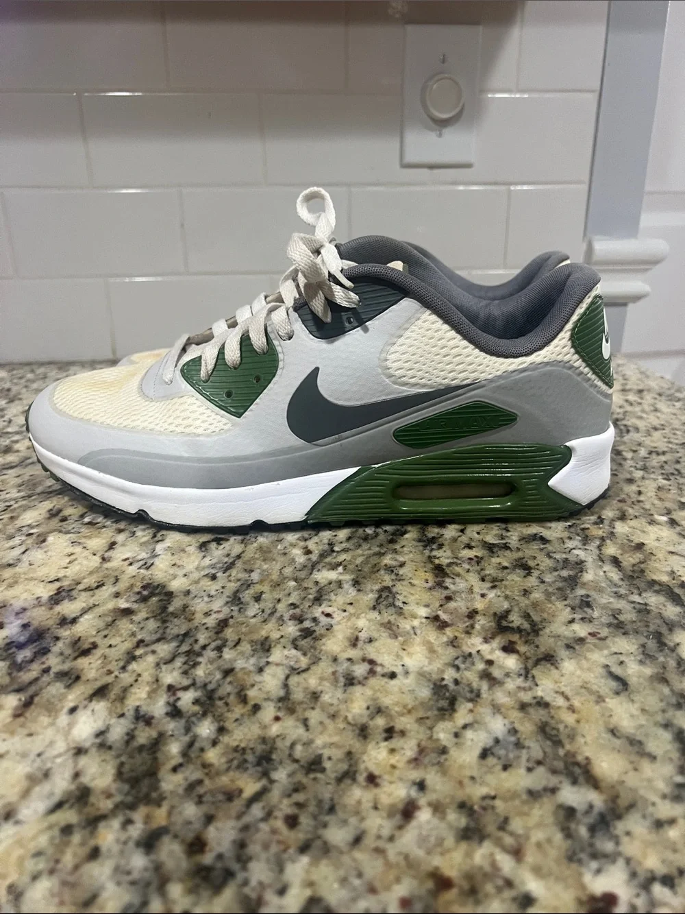 Nike gray, green and white athletic sneaker
